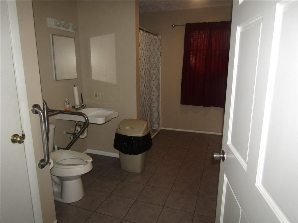 724 Stewart Street Berlin, PA 15530 - Photo 11 of 20 a bathroom with a toilet and a shower