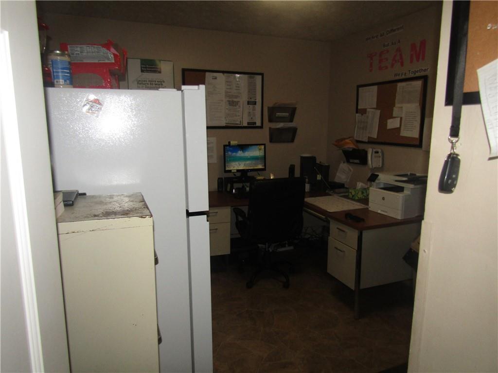 724 Stewart Street Berlin, PA 15530 - Photo 13 of 20 a room with refrigerator and cabinets