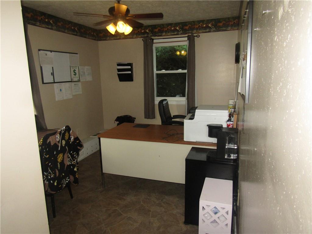 724 Stewart Street Berlin, PA 15530 - Photo 14 of 20 a living room with furniture and a chandelier