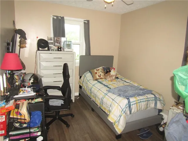 a bedroom with a bed and a table in it