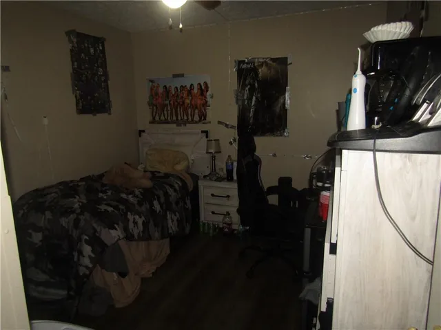 a bed room with a bed and a television