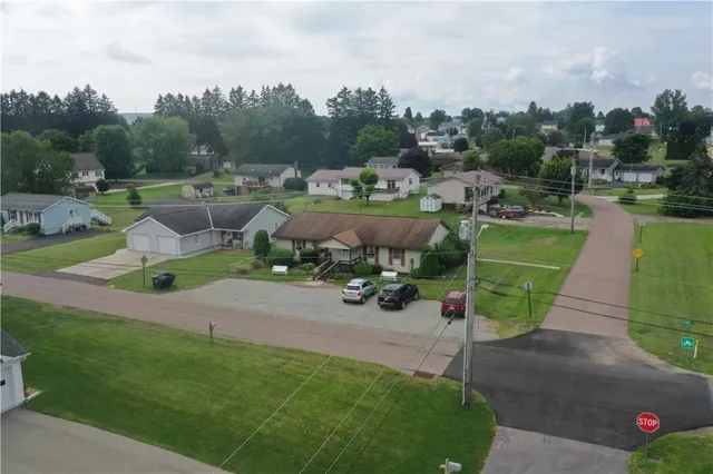 an aerial view of a garden with houses