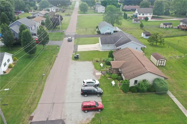 an aerial view of house with yard swimming pool and outdoor seating