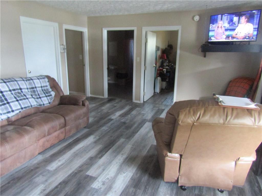 724 Stewart Street Berlin, PA 15530 - Photo 7 of 20 a bedroom with a bed and glass windows