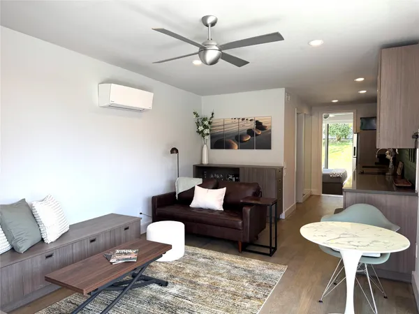 a living room with furniture and a table