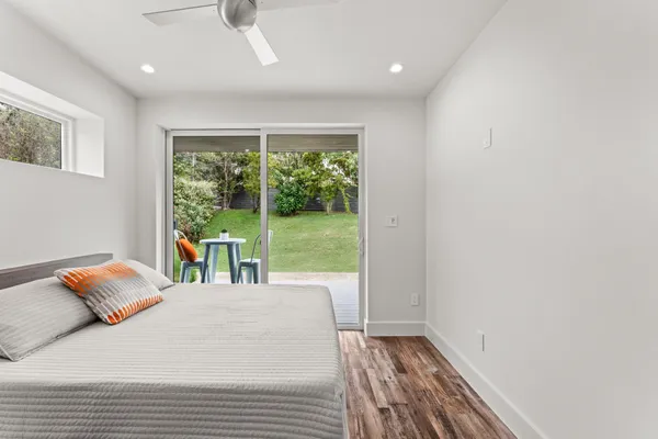 a bedroom with a large bed and a window