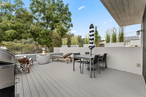 a view of a tables and chairs in patio of the house