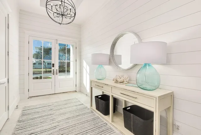 a spacious bedroom with a large bed and a flat screen tv