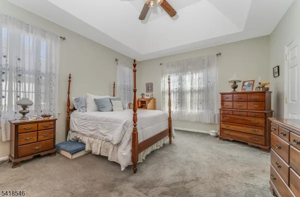 a room with a bed and furniture