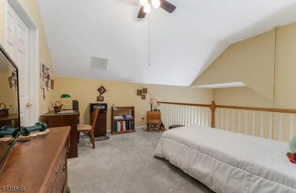 a bed room with furniture and a window
