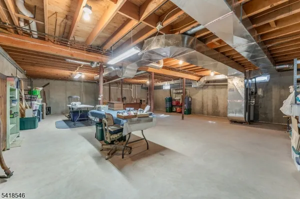 a view of a storage room with a table and chairs