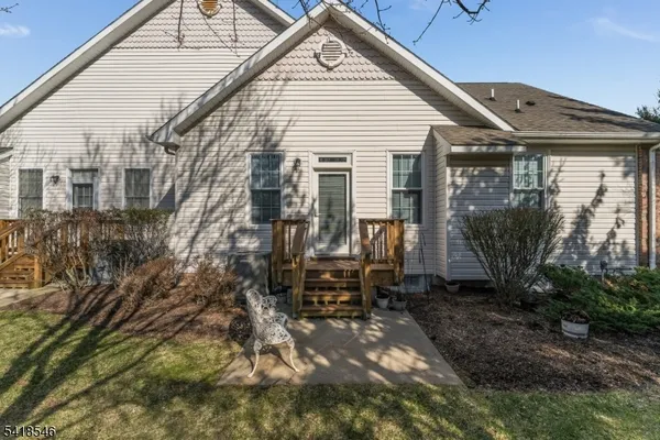 a view of house with backyard