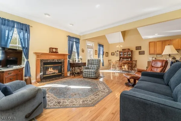 a living room with furniture fireplace and a flat screen tv