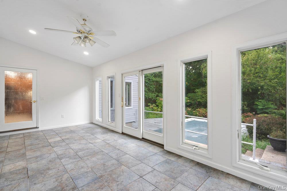 83 Shore Road Mount Sinai, NY 11766 - Photo 18 of 33 a view of an empty room with a window