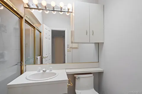 a bathroom with a sink and mirror
