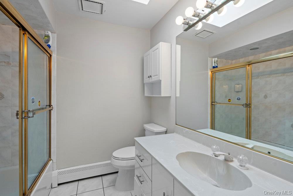 83 Shore Road Mount Sinai, NY 11766 - Photo 24 of 33 a bathroom with a sink a toilet and shower