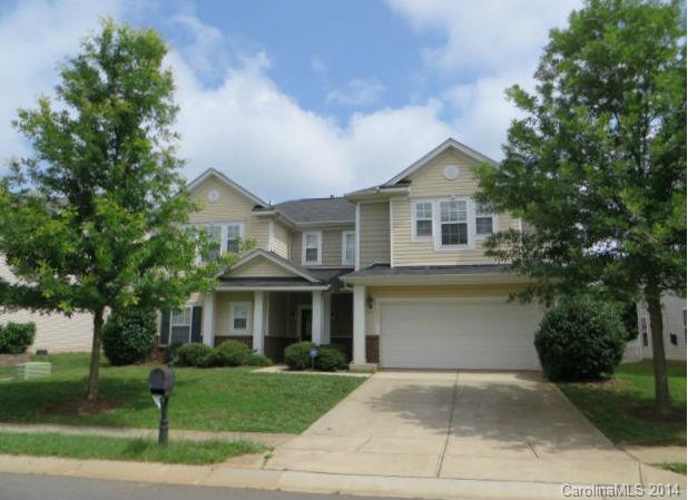 6644 Evanton Loch Road Charlotte, NC 28278 - Photo 1 of 24 a front view of a house with a yard and garage