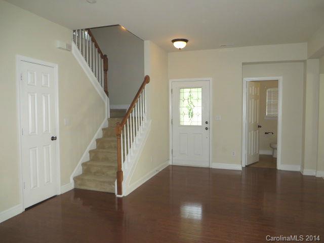 6644 Evanton Loch Road Charlotte, NC 28278 - Photo 2 of 24 a view of a hallway with entryway wooden floor and front door