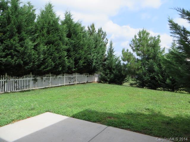 6644 Evanton Loch Road Charlotte, NC 28278 - Photo 12 of 24 a backyard of a house with lots of green space