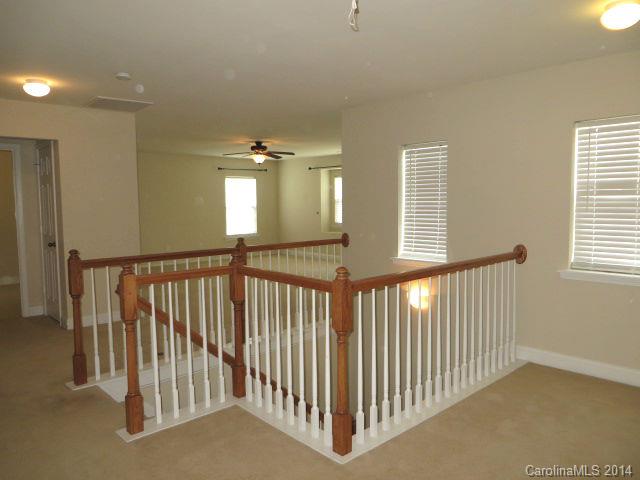 6644 Evanton Loch Road Charlotte, NC 28278 - Photo 15 of 24 a view of a hallway with windows
