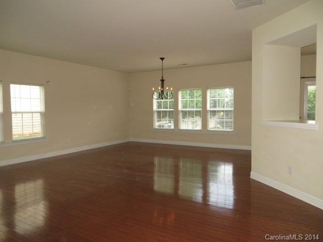 6644 Evanton Loch Road Charlotte, NC 28278 - Photo 3 of 24 an empty room with wooden floor and windows