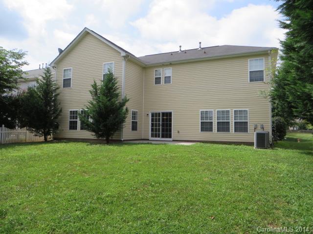 6644 Evanton Loch Road Charlotte, NC 28278 - Photo 21 of 24 a view of a house with a backyard