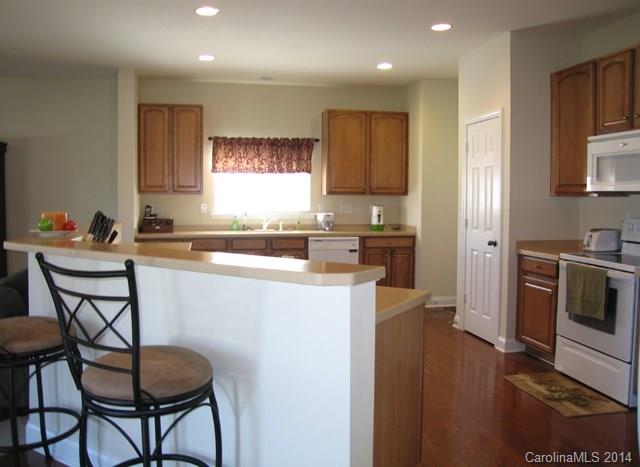 6644 Evanton Loch Road Charlotte, NC 28278 - Photo 8 of 24 a kitchen that has a cabinets counter space and appliances