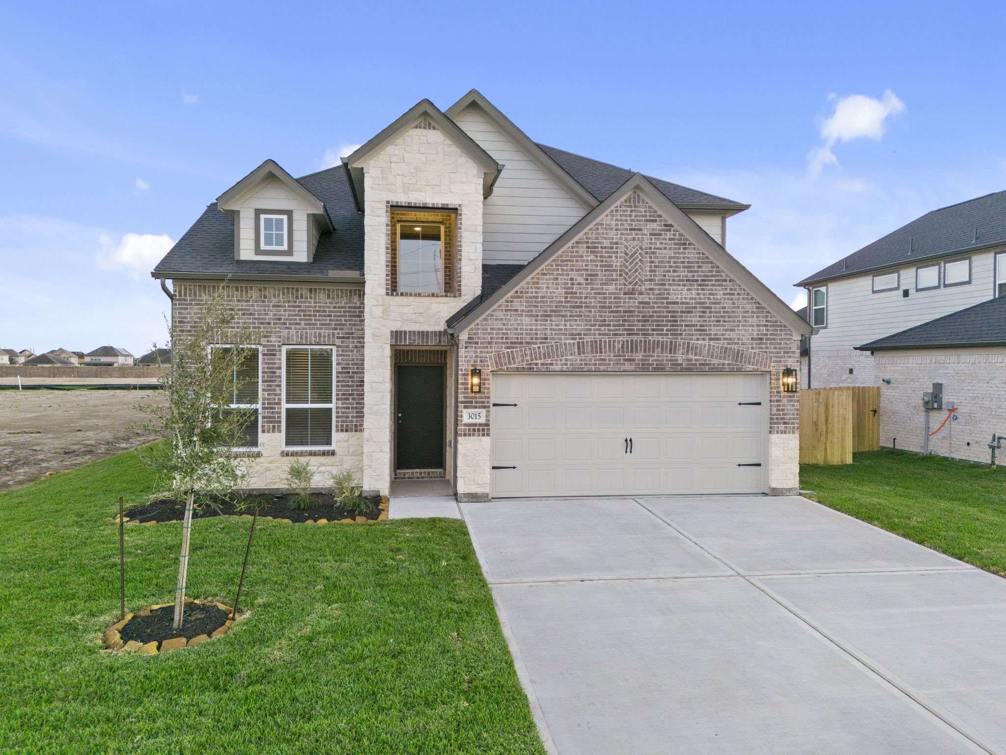 3015 Boulder Ridge Drive Rosenberg, TX 77471 - Photo 34 of 34 a front view of a house with garden