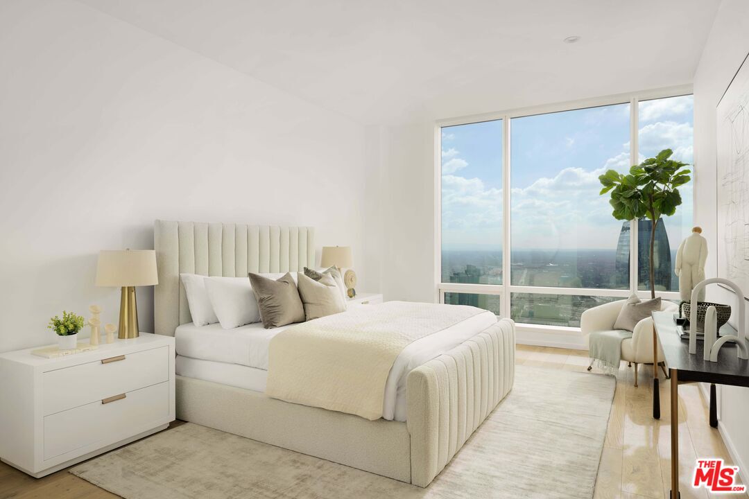 1000 West 8th Street, Unit PH5802 Los Angeles, CA 90017 - Photo 15 of 57 a bedroom with a bed and a potted plant