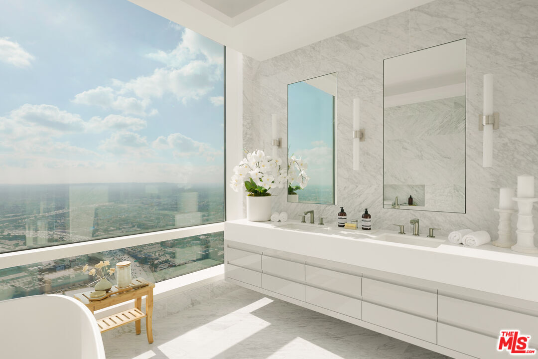 1000 West 8th Street, Unit PH5802 Los Angeles, CA 90017 - Photo 18 of 57 a bathroom with a double vanity sink and a mirror