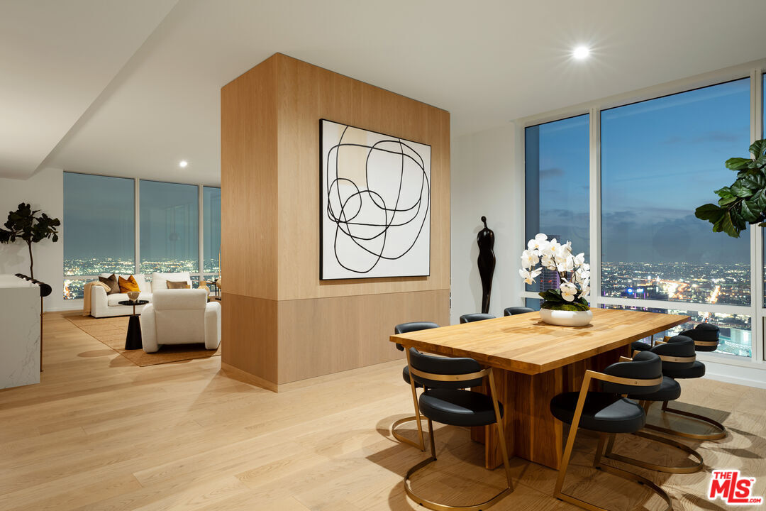1000 West 8th Street, Unit PH5802 Los Angeles, CA 90017 - Photo 34 of 57 a view of a dining room with furniture and wooden floor