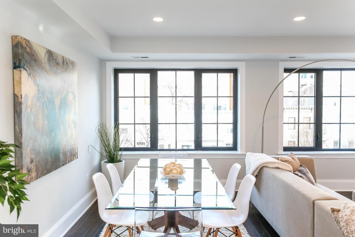 1514 8th Street Northwest, Unit 5 Washington, DC 20001 - Photo 1 of 15 a living room with furniture and a large window