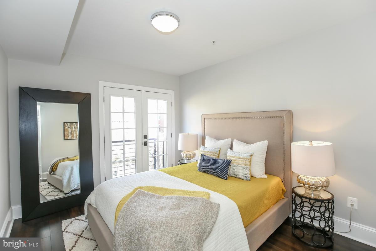1514 8th Street Northwest, Unit 5 Washington, DC 20001 - Photo 4 of 15 a bedroom with a bed and window