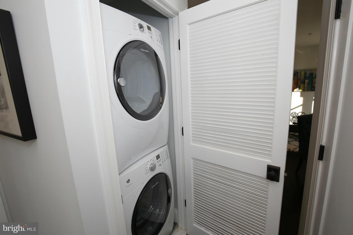 1514 8th Street Northwest, Unit 5 Washington, DC 20001 - Photo 8 of 15 a utility room with dryer and washer