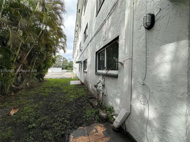 a view of yard from a corridor