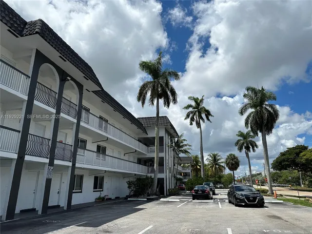 a view of multiple houses with a street