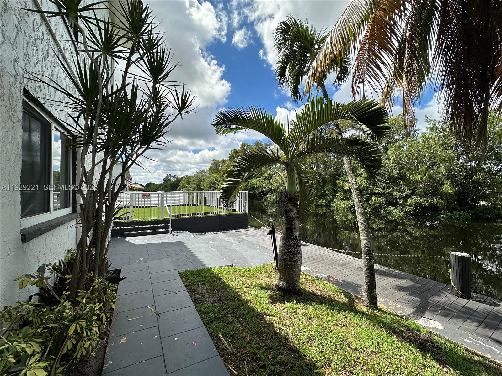 1400 Northeast 56th Street, Unit 105 Fort Lauderdale, FL 33334 - Photo 35 of 42 a view of a park with palm trees
