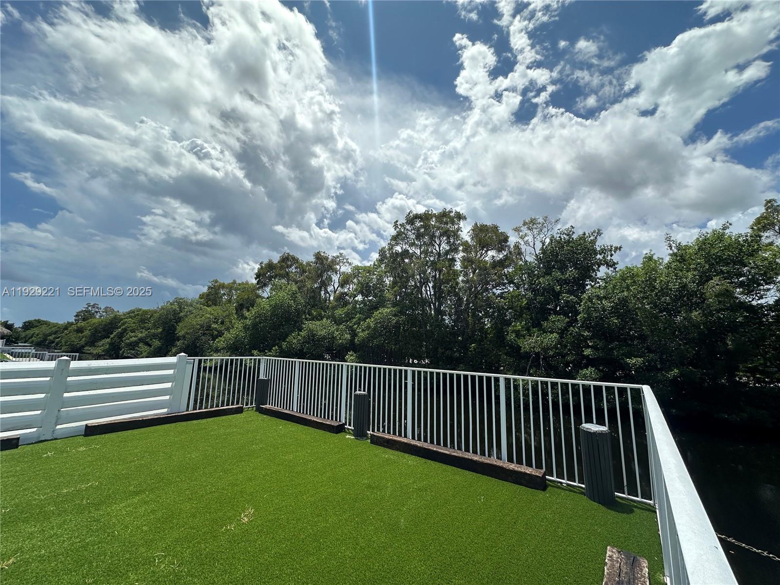 1400 Northeast 56th Street, Unit 105 Fort Lauderdale, FL 33334 - Photo 38 of 42 a view of a garden