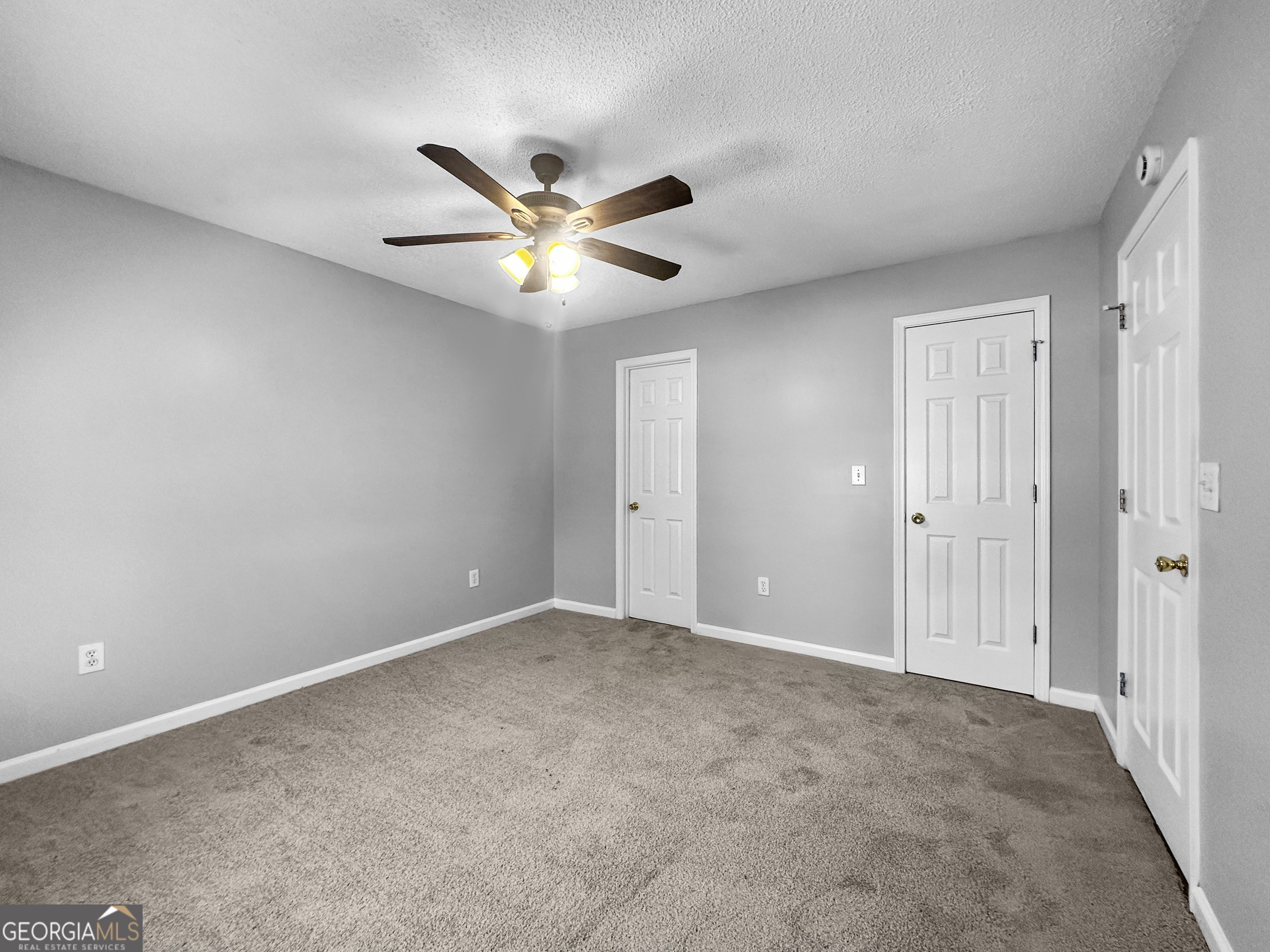 368 Wesley Mill Place Villa Rica, GA 30180 - Photo 11 of 18 an empty room with a ceiling fan and a window