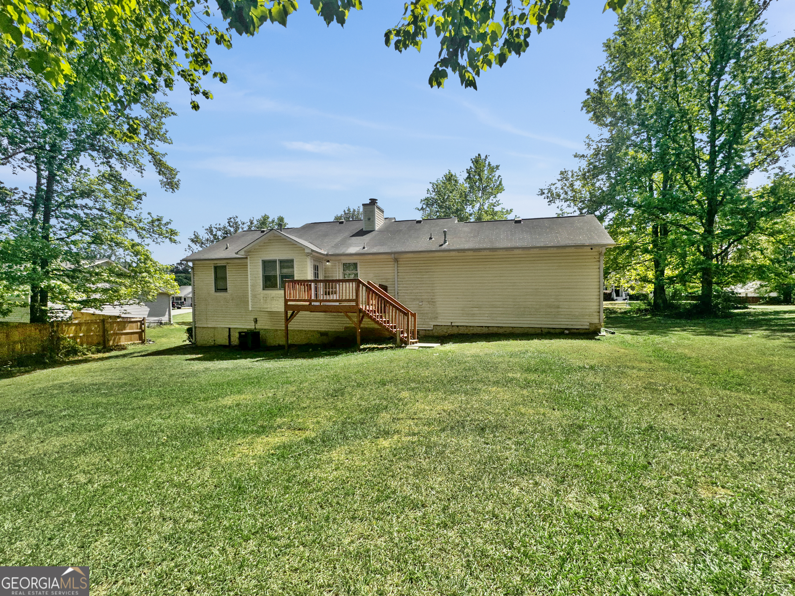 368 Wesley Mill Place Villa Rica, GA 30180 - Photo 16 of 18 a view of a house with a garden