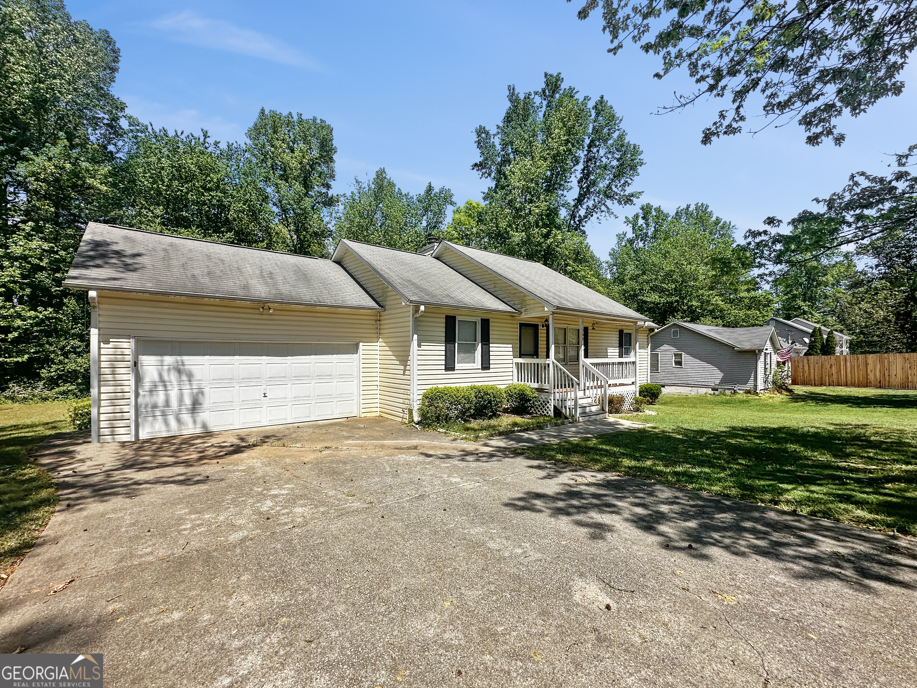 368 Wesley Mill Place Villa Rica, GA 30180 - Photo 2 of 18 a view of a house with a yard and tree s