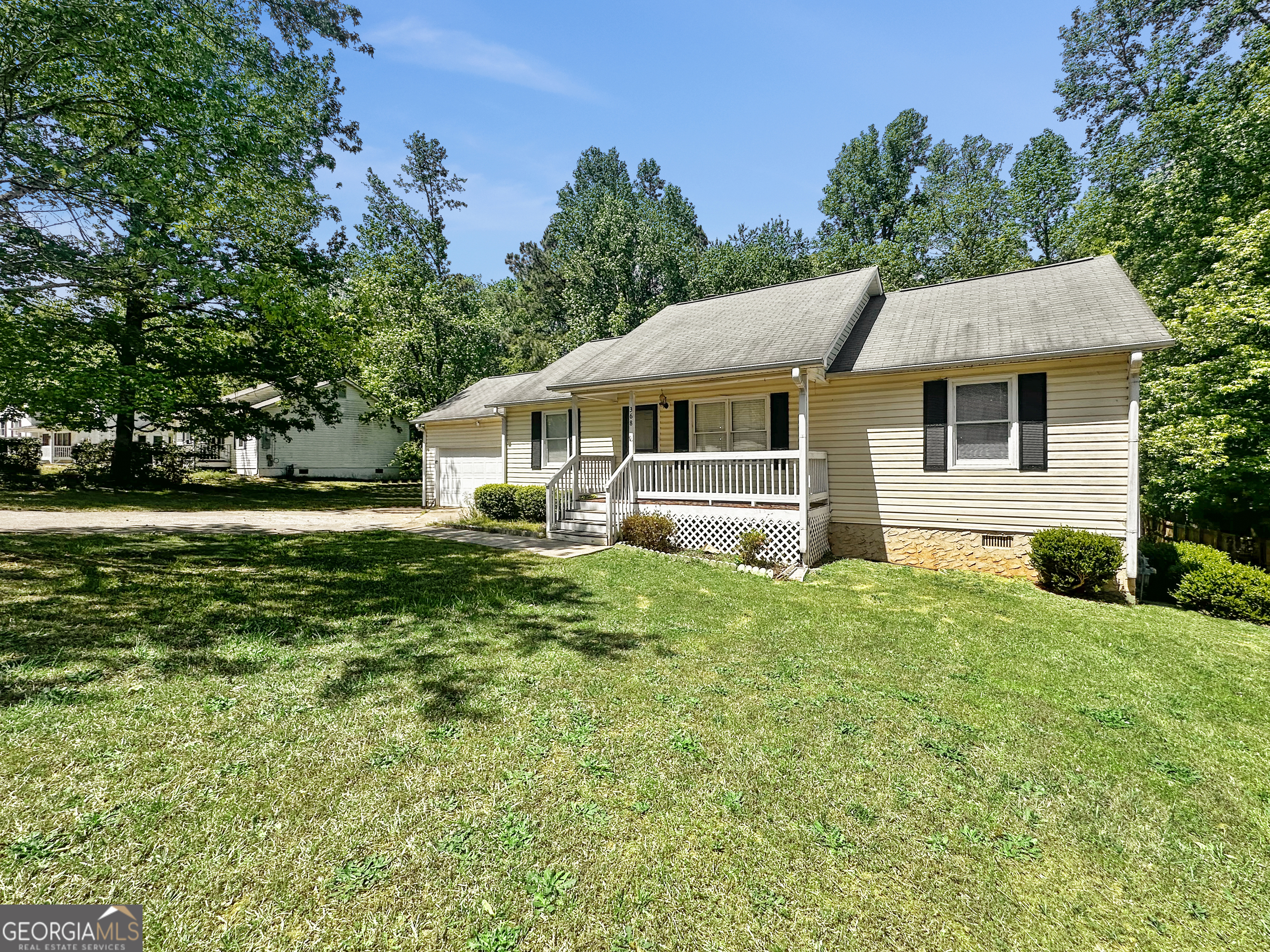 368 Wesley Mill Place Villa Rica, GA 30180 - Photo 3 of 18 a front view of a house with a yard