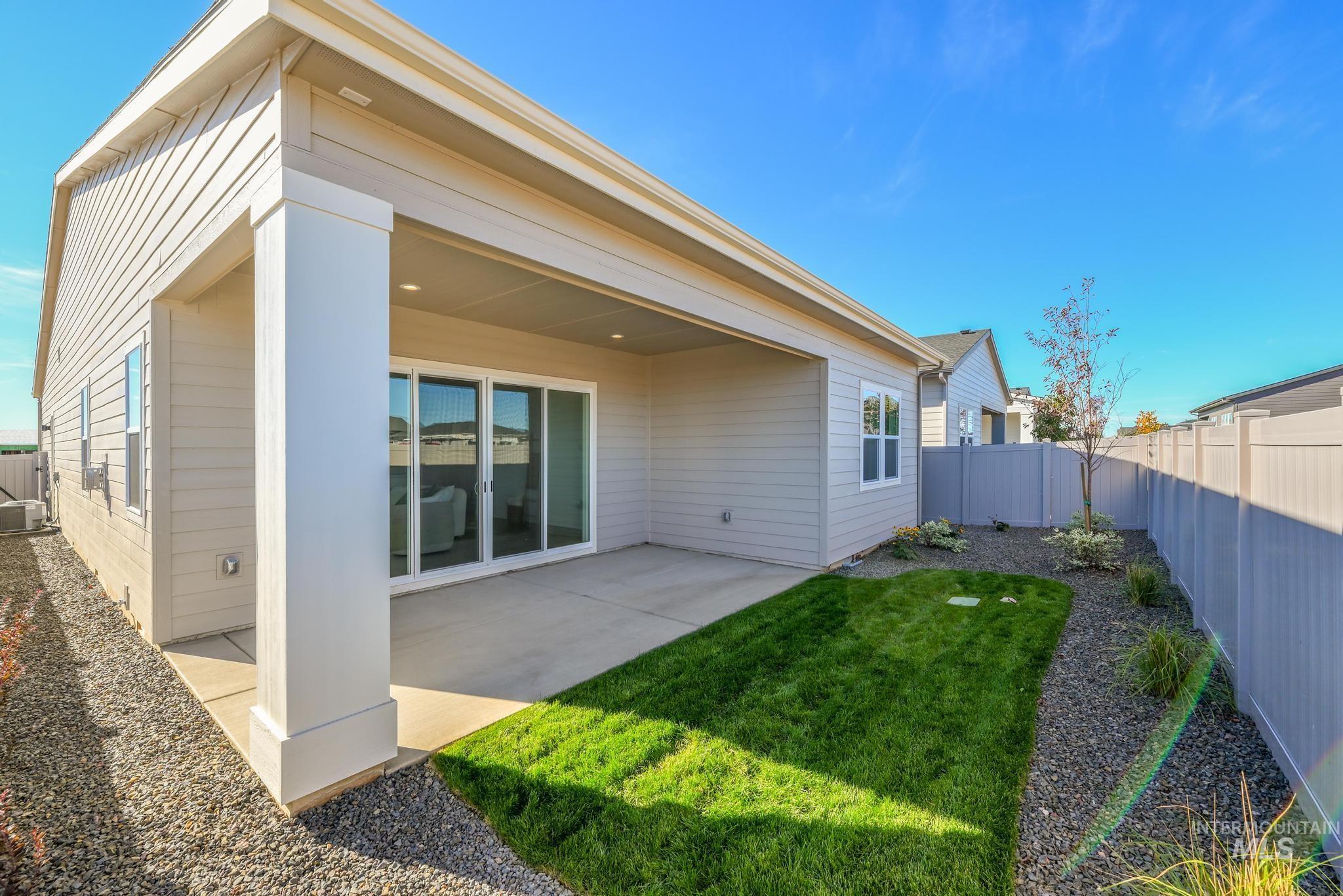 8555 West Fanning Street Star, ID 83669 - Photo 11 of 11 Rear view of house with a patio area and a fenced backyard