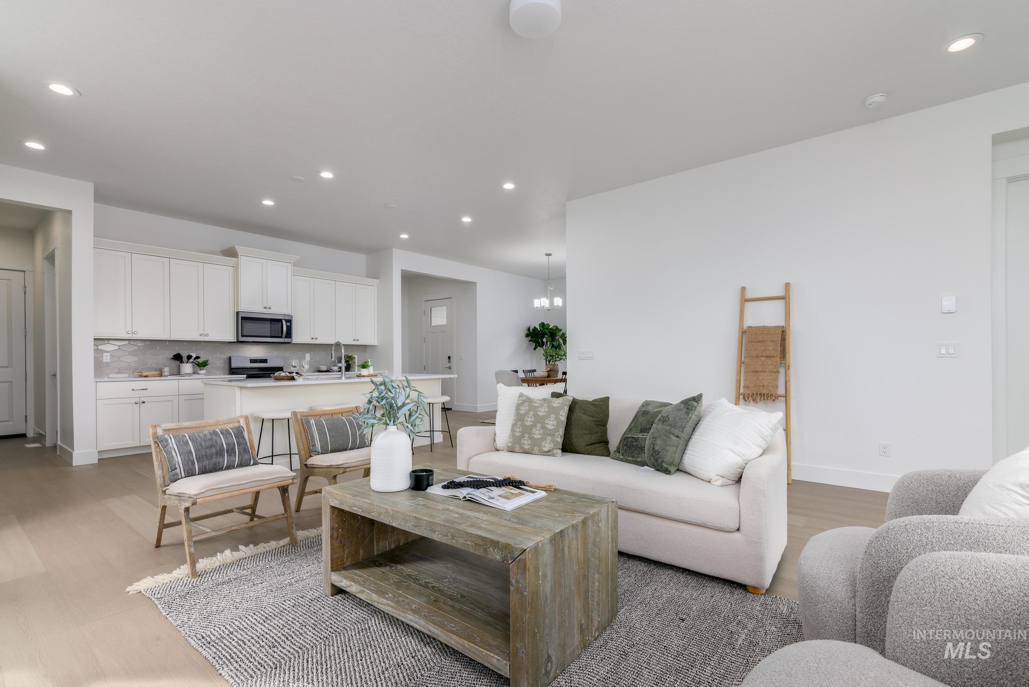 8555 West Fanning Street Star, ID 83669 - Photo 4 of 11 Living area with recessed lighting, light wood-type flooring, and a chandelier