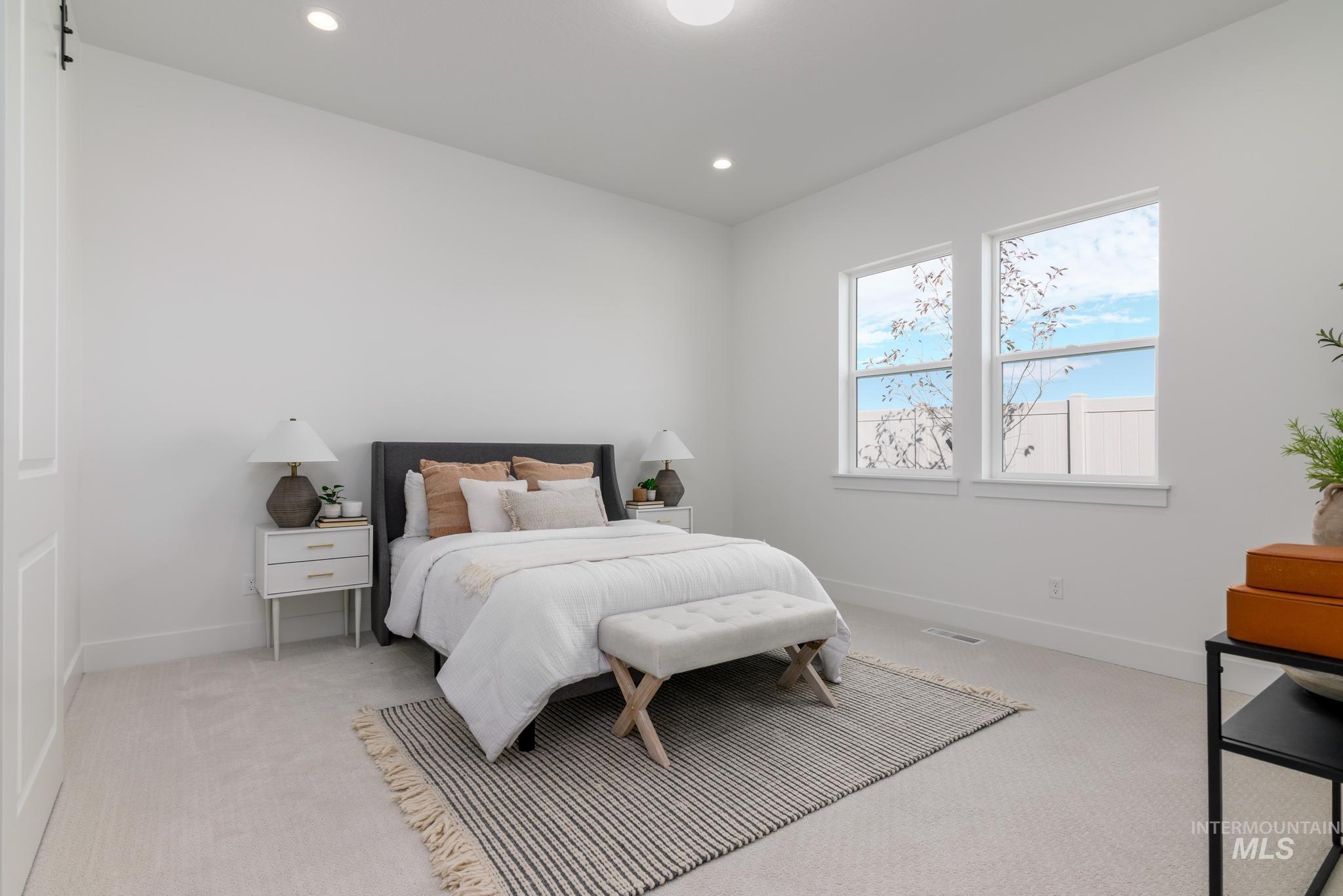 8555 West Fanning Street Star, ID 83669 - Photo 7 of 11 Bedroom with light colored carpet and recessed lighting