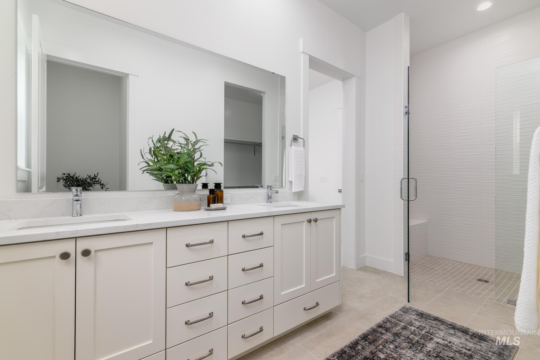 8555 West Fanning Street Star, ID 83669 - Photo 10 of 11 Full bathroom with double vanity, a shower stall, light tile patterned floors, and recessed lighting