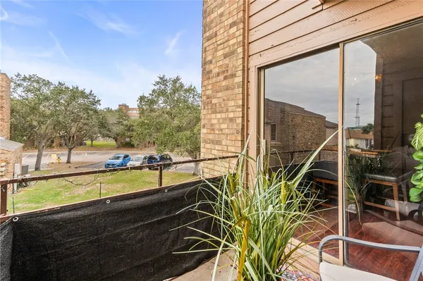 a view of a balcony with chairs