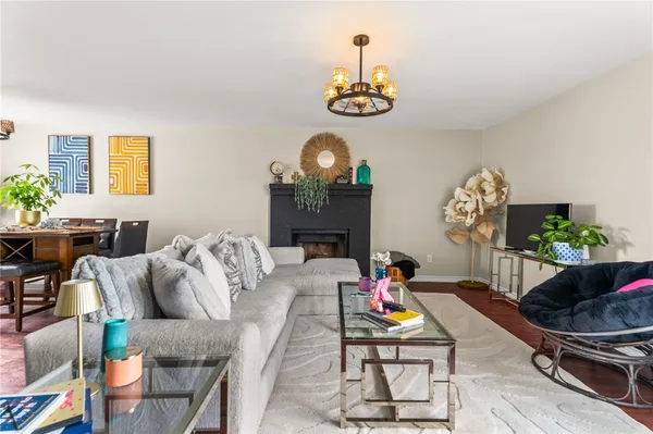 a view of a dining room with furniture and chandelier