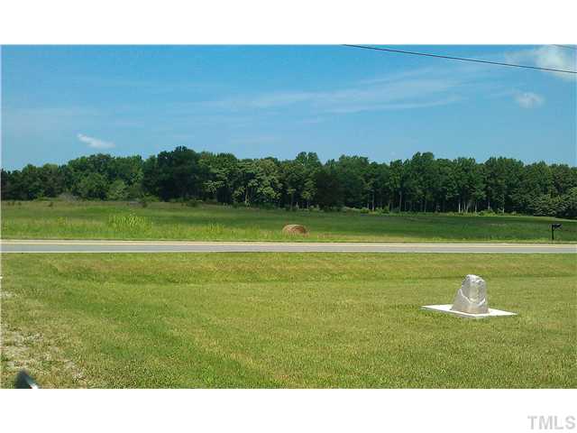 2363 Blalock Dairy Road Roxboro, NC 27574 - Photo 4 of 4 a view of a golf course with a lake