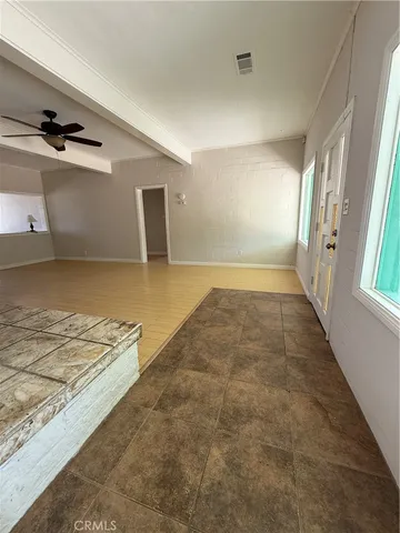 a view of hallway with wooden floor